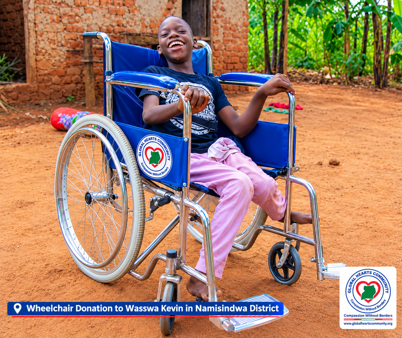 Wasswa Kevin with his new wheelchair in Namisindwa