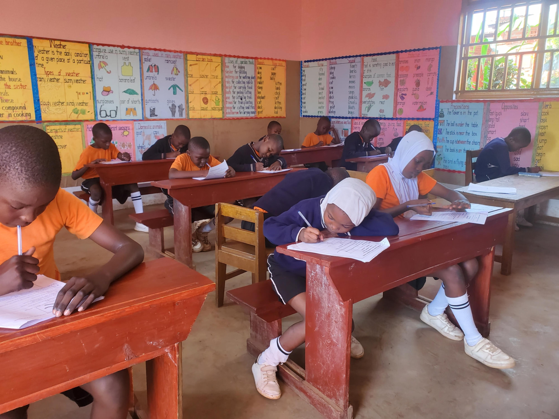 Primary school pupils working in their classroom.